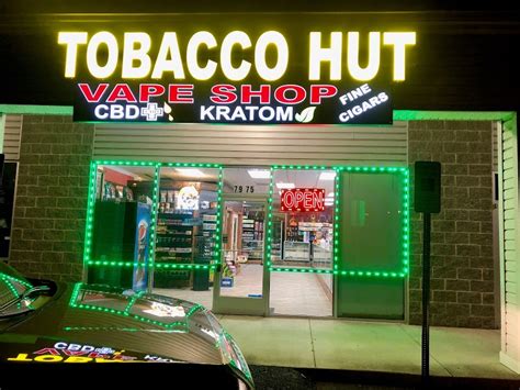 a group of five people entered the store. . Tobacco hut and vape arlington va